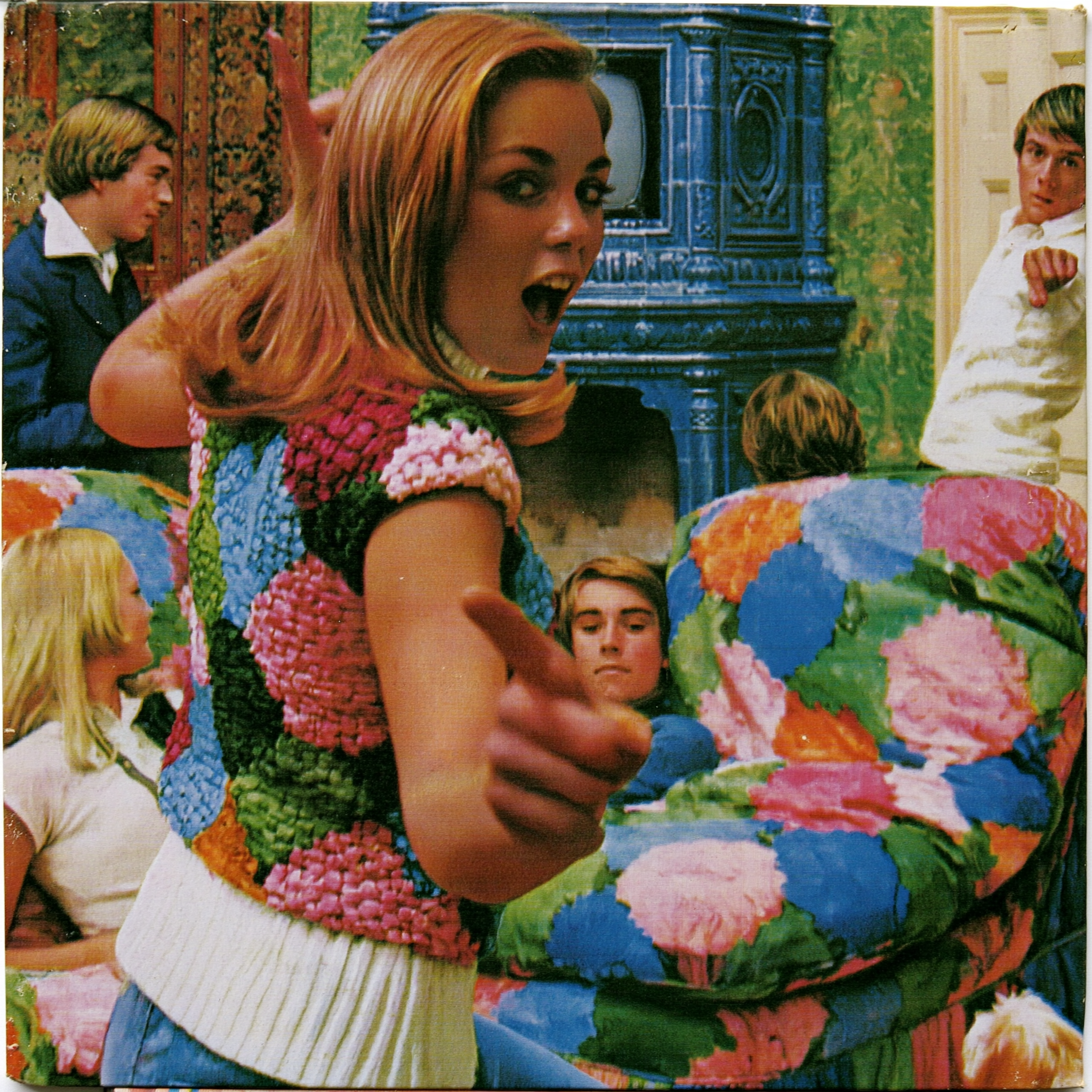 Retro party scene — someone pointing at the camera